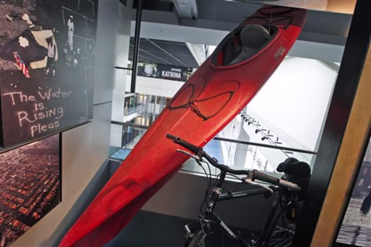 A kayak used by New Orleans Times-Picayune staff photographer John McCusker and a bicycle, both used to cover the story, are seen on display at the Newseum in Washington for their exhibit on press coverage of Hurricane Katrina and its aftermath, Tuesday, Aug. 24, 2010. (AP Photo/Charles Dharapak)